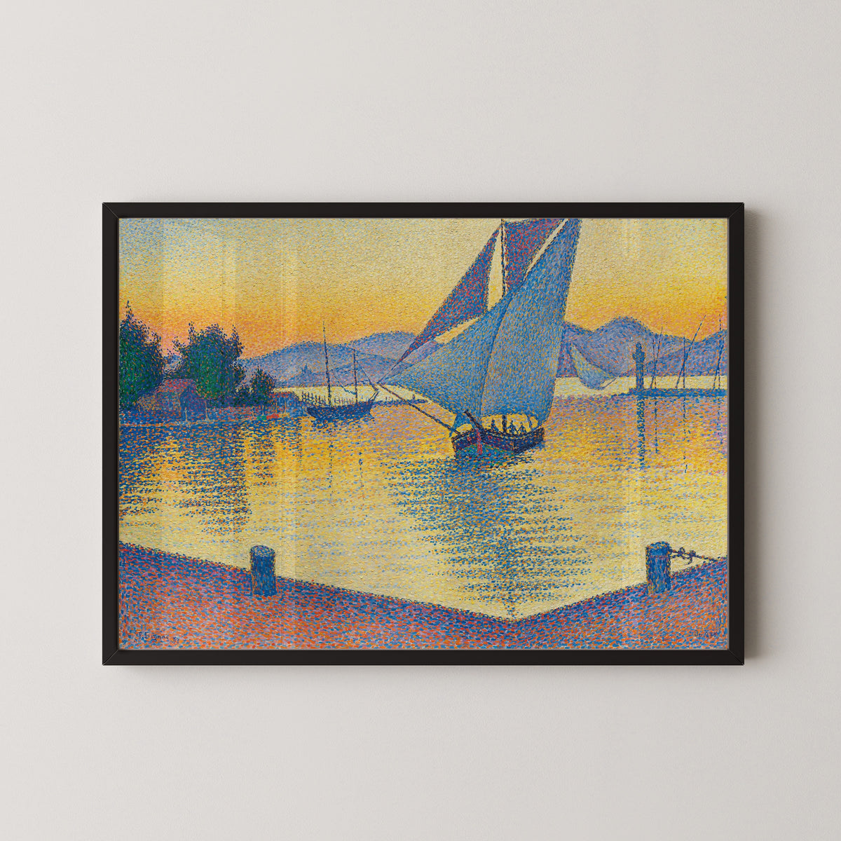 Framed art print of The Port at Sunset, Opus 236, Saint-Tropez by Paul Signac, in a black frame on a pale wall