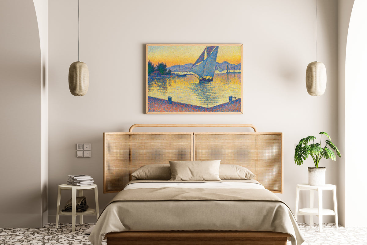 Framed art print of The Port at Sunset, Opus 236, Saint-Tropez by Paul Signac, above a cane-headboard bed