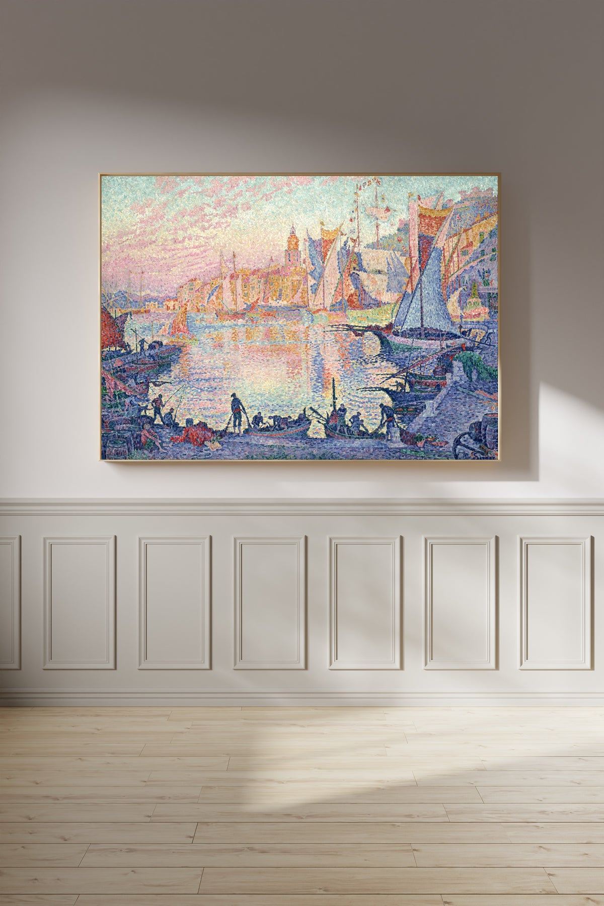 Framed art print of The Port of Saint-Tropez by Paul Signac, on a panelled wall in afternoon light