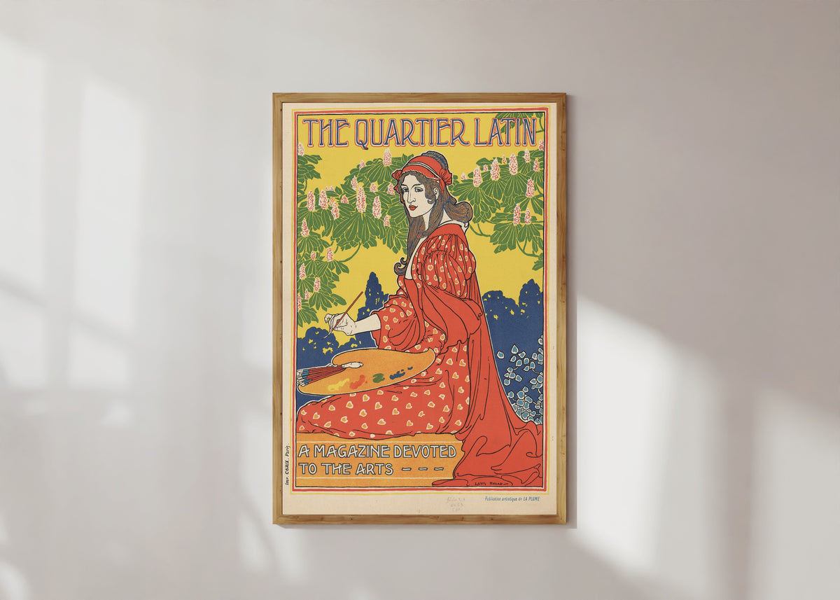 Framed art print of The Quartier Latin, A Magazine Devoted to the Arts by Louis Rhead, in a light wood frame on a sunlit white wall