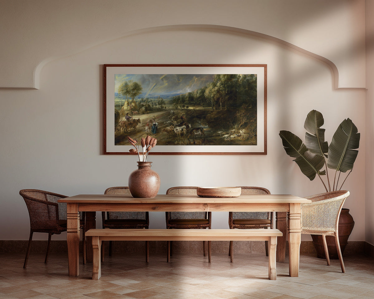 Framed art print of The Rainbow Landscape by Peter Paul Rubens, above a wooden dining table