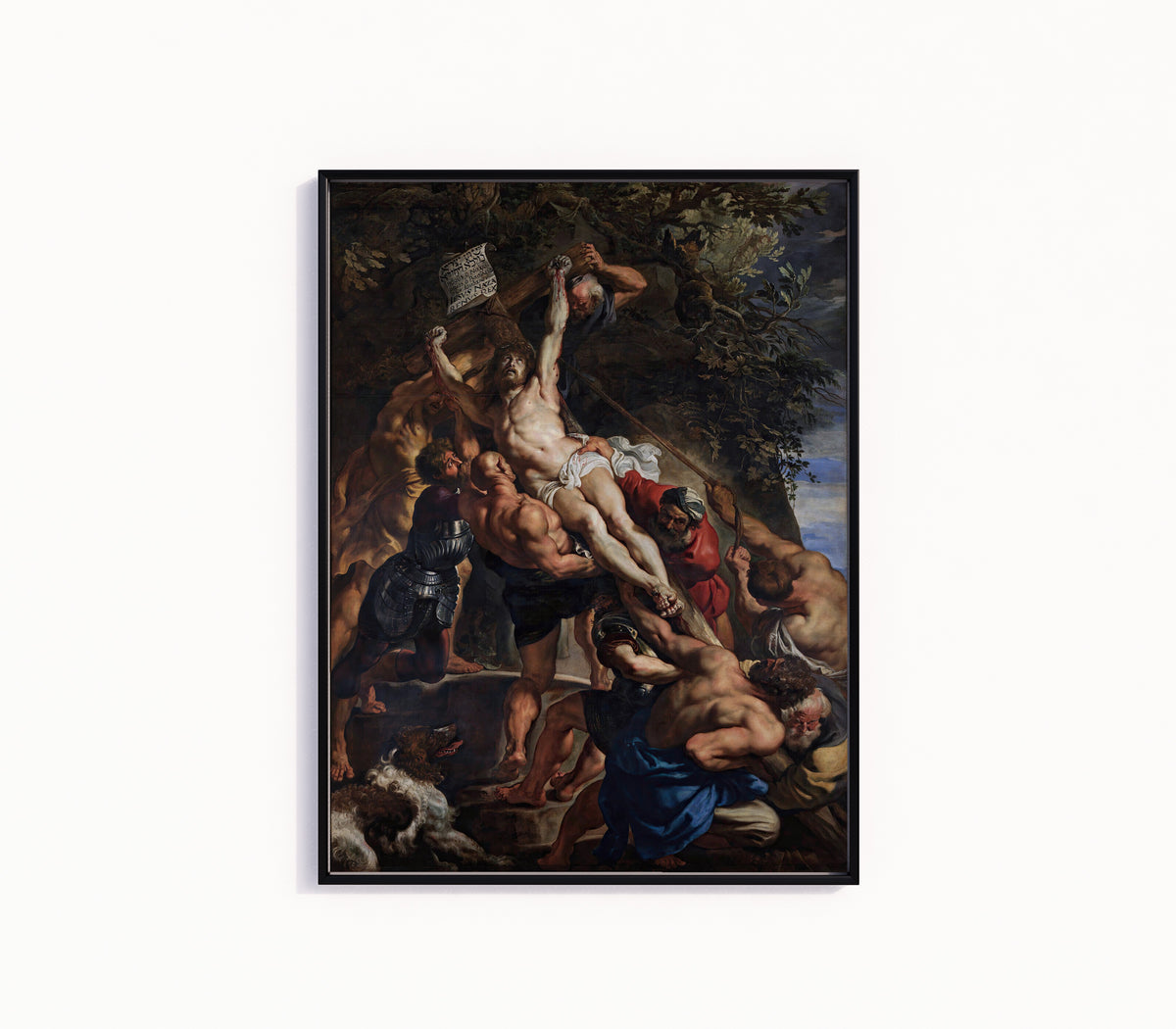 Framed art print of The Raising of the Cross (Central Panel) by Peter Paul Rubens, in a slim black frame on a plain white wall