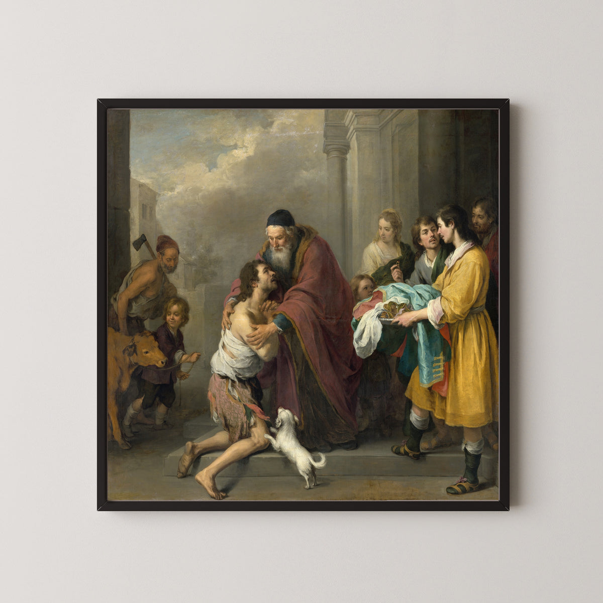 Framed art print of The Return of the Prodigal Son by Bartolomé Esteban Murillo, in a black frame on a pale wall