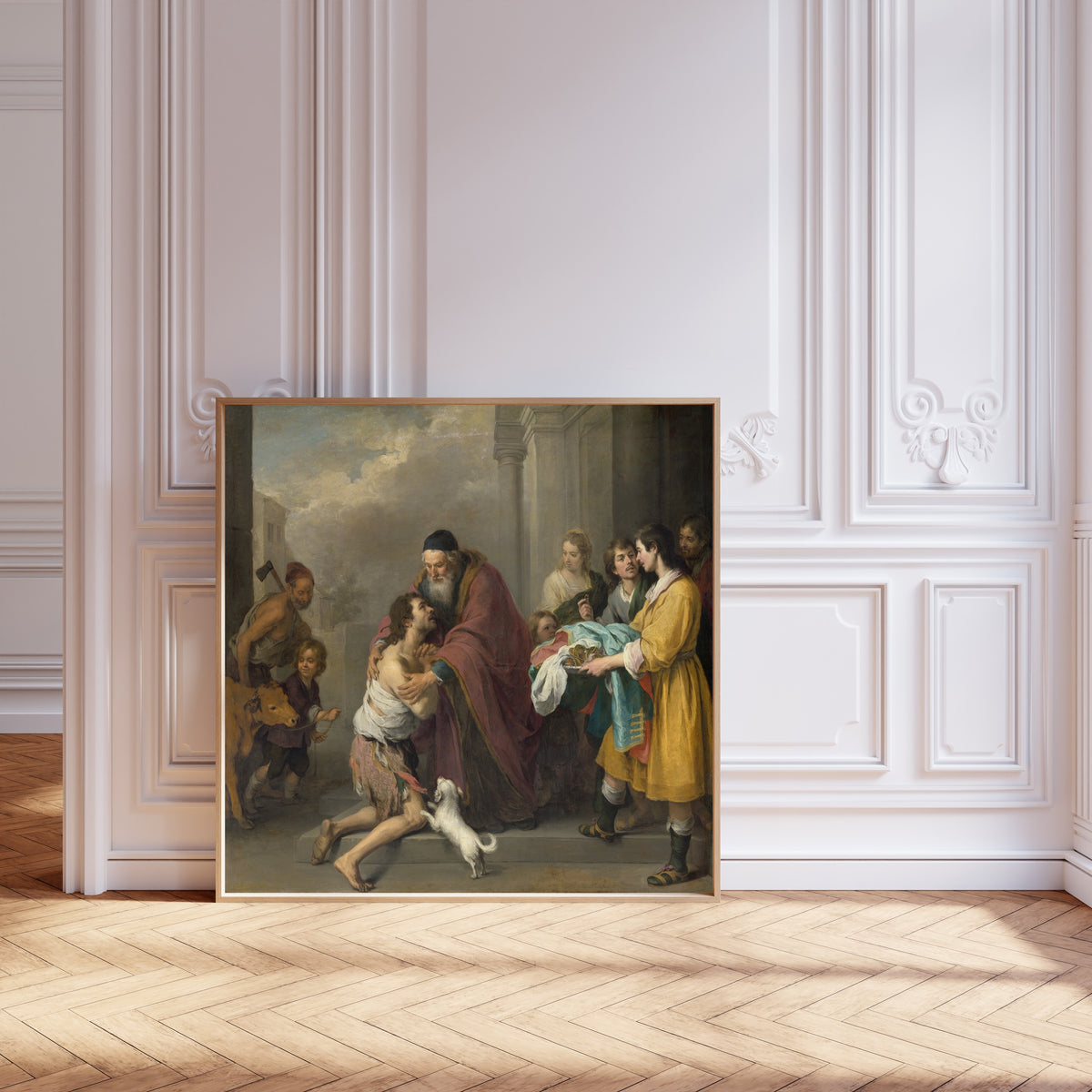 Framed art print of The Return of the Prodigal Son by Bartolomé Esteban Murillo, leaning against pale pink panelling on a herringbone floor