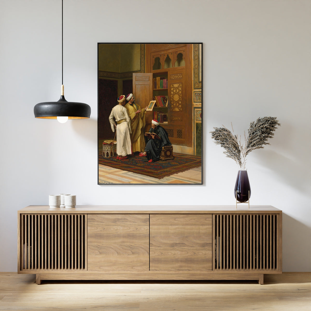 Framed art print of The Scholars by Ludwig Deutsch, above a slatted wood sideboard