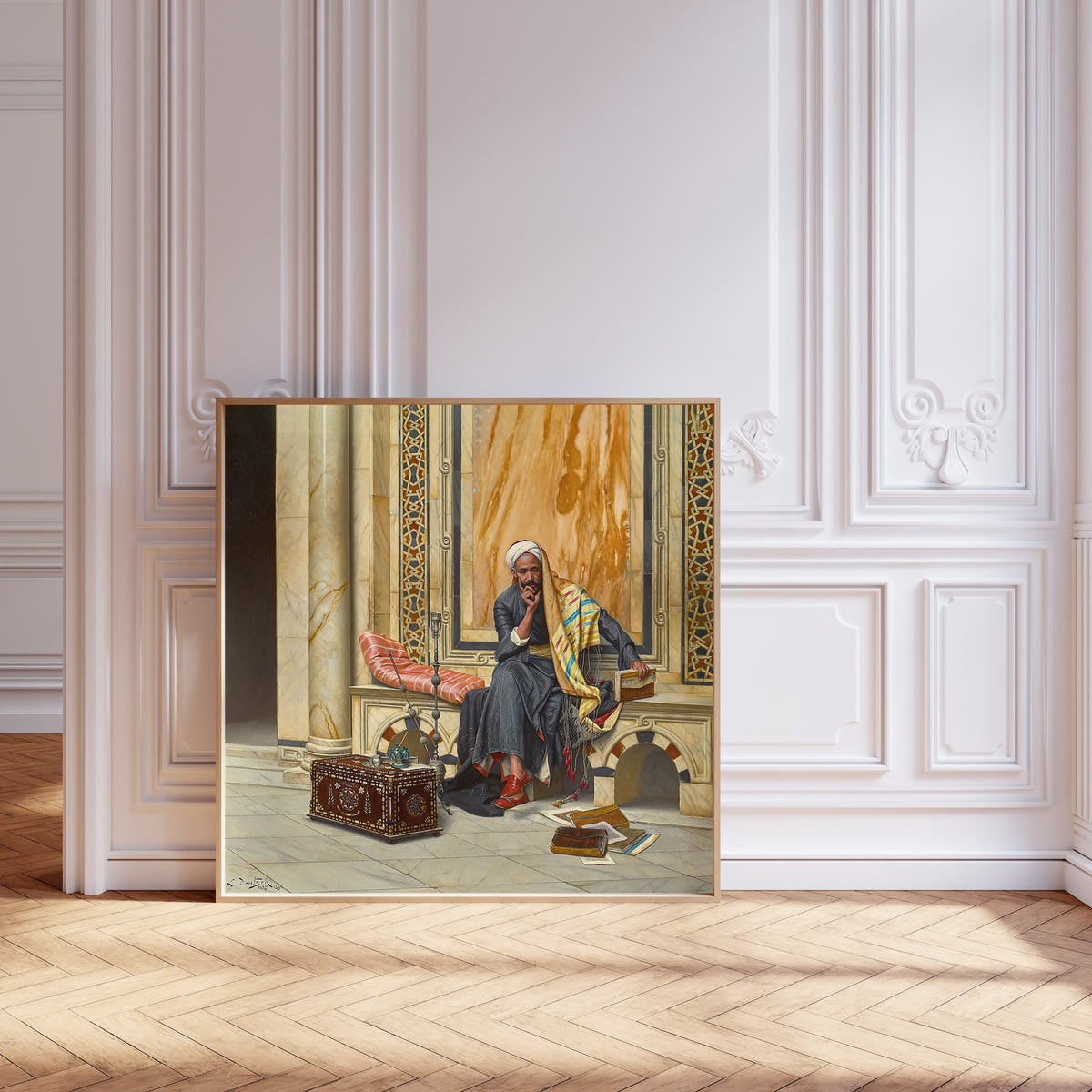 Framed art print of The Scribe by Ludwig Deutsch, leaning against pale pink panelling on a herringbone floor