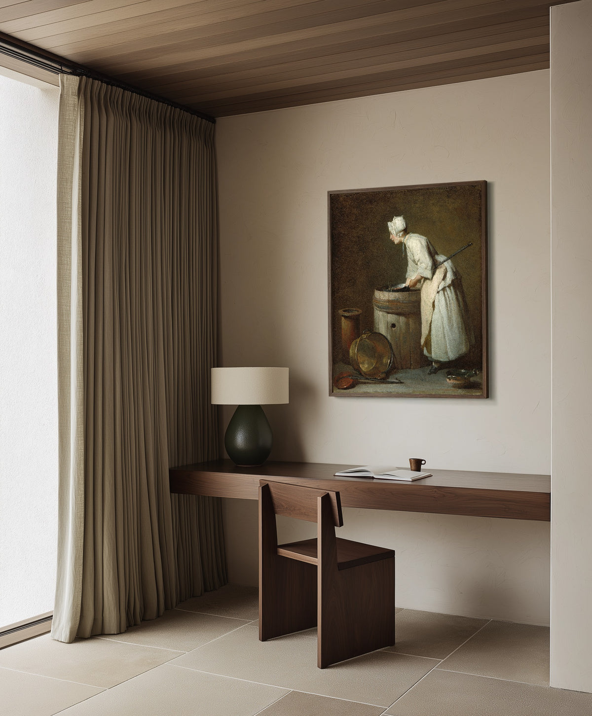 Framed art print of The Scullery Maid by Jean-Siméon Chardin, in a dark wood frame on a plaster wall above a walnut desk