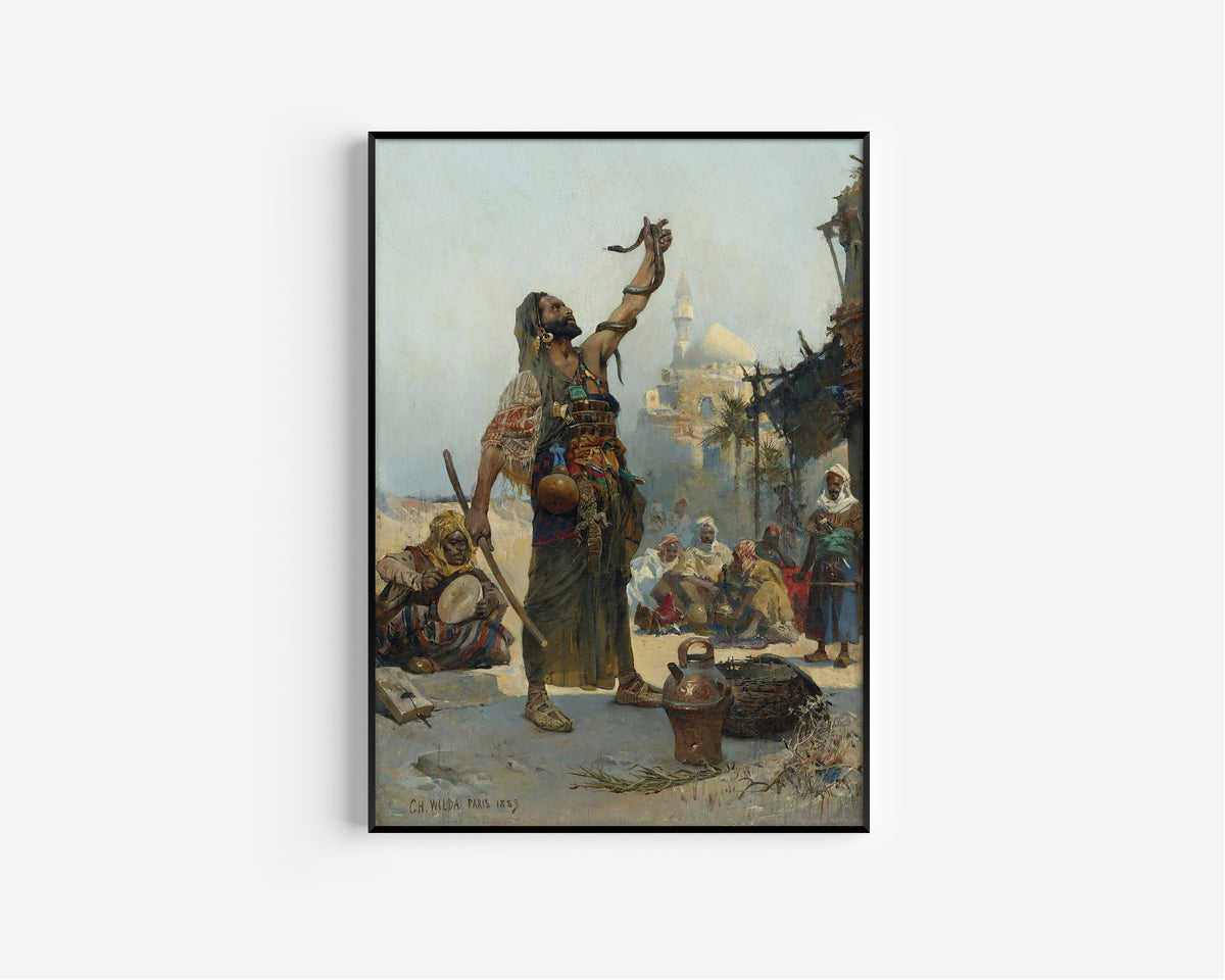 The Snake Charmer by Charles Wilda — in a slim black frame on a plain white wall
