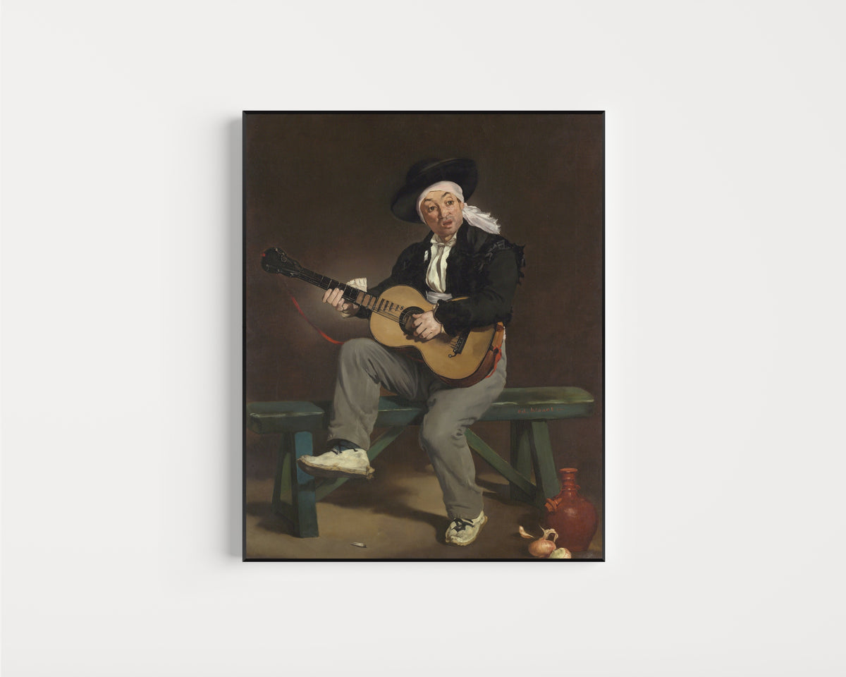 Framed art print of The Spanish Singer by Édouard Manet, in a slim black frame on a plain white wall
