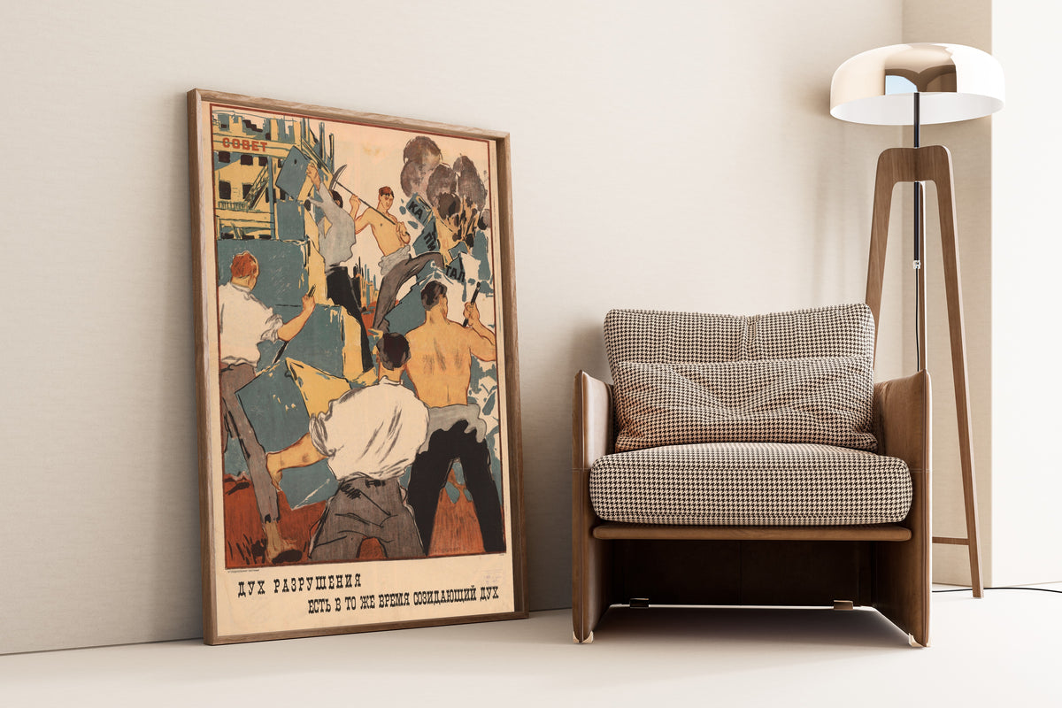 Framed art print of The Spirit of Destruction Is at the Same Time a Creative Spirit, leaning against a wall beside an armchair and a floor lamp