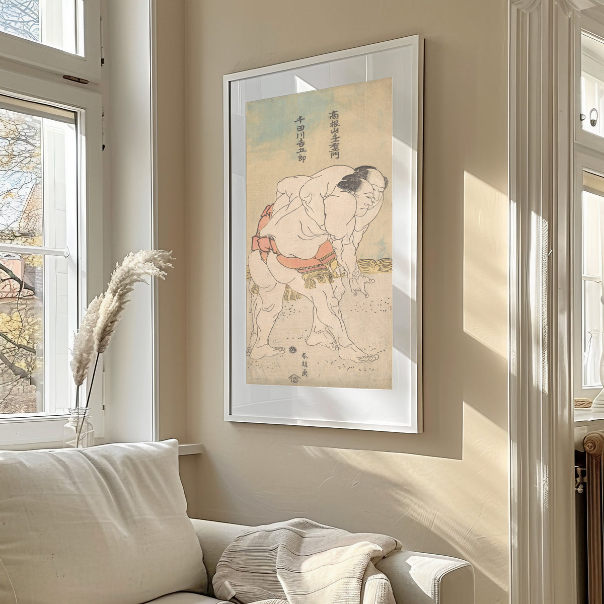 Framed art print of The Sumo Wrestlers Takaneyama Yoichiemon and Sendagawa Kichigorō by Katsushika Hokusai, in a sunlit living room above a sofa