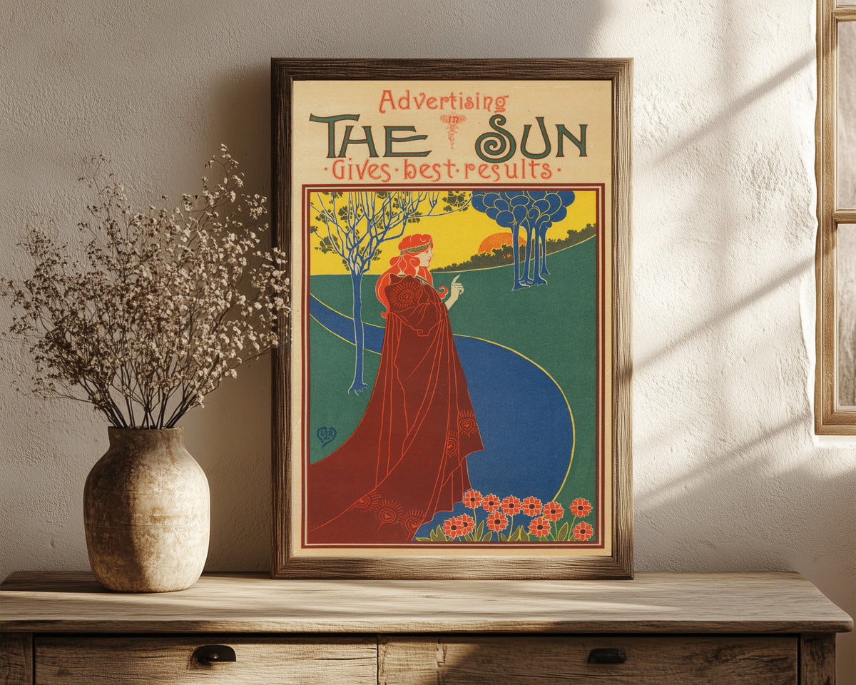 Framed art print of The Sun Gives Good Results by Louis Rhead, in a dark wood frame leaning on a rustic console beside dried flowers