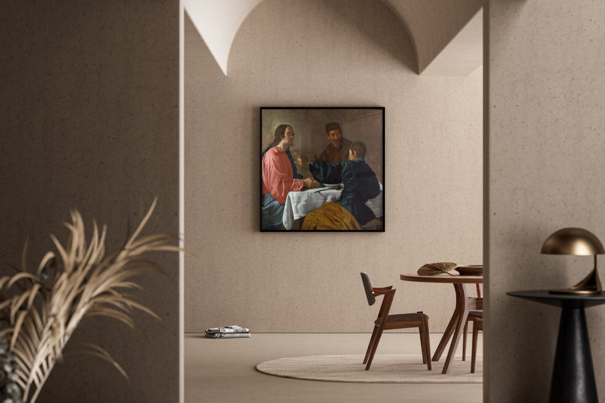 Framed art print of The Supper at Emmaus by Diego Velázquez, in a sunlit dining corner