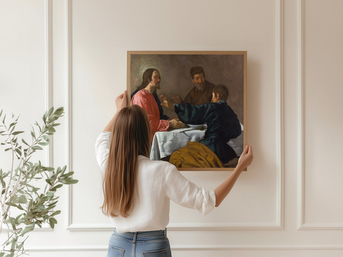 Framed art print of The Supper at Emmaus by Diego Velázquez, hung on a panelled wall