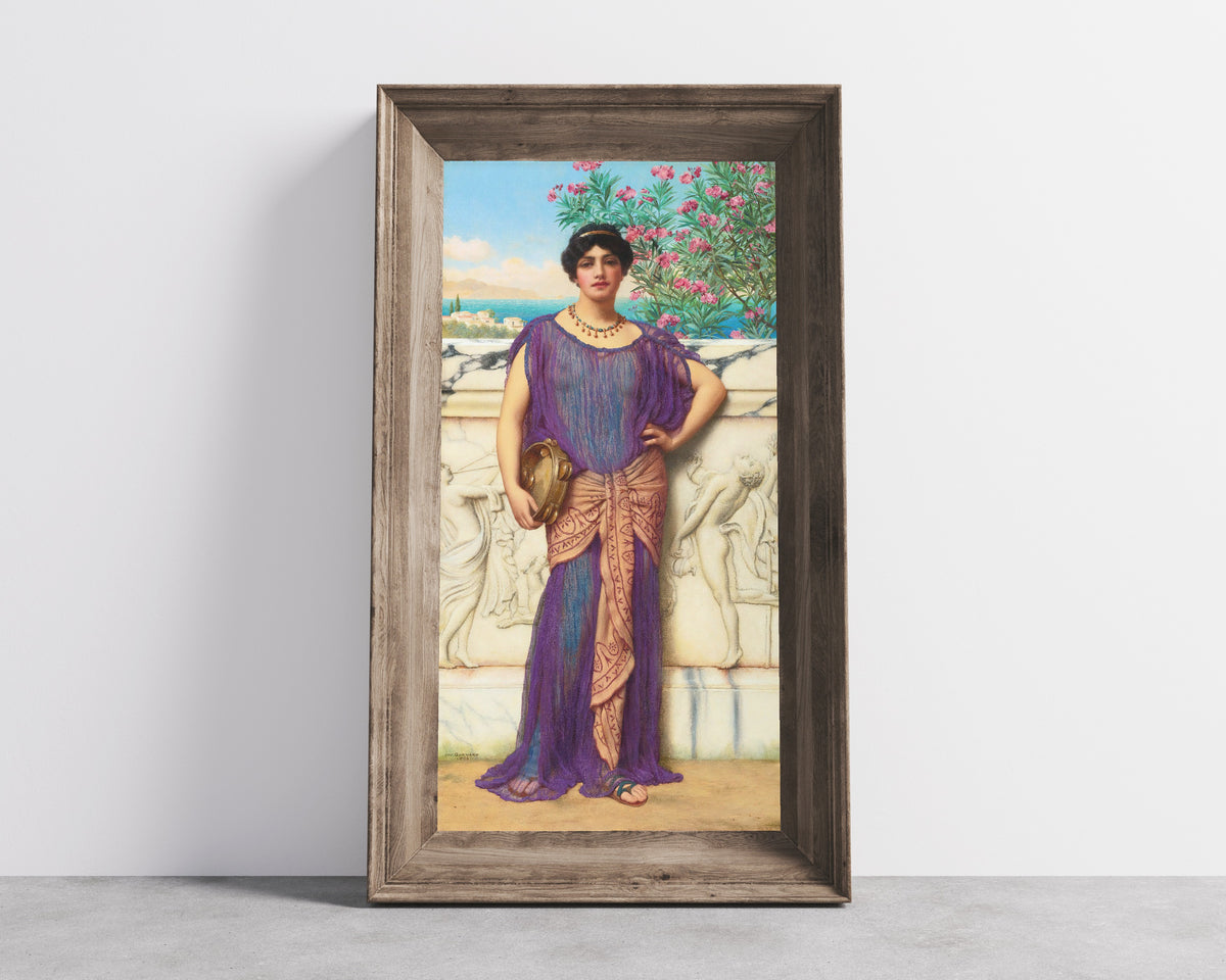 Framed art print of The Tambourine Girl by John William Godward, in a wide wooden frame leaning against a concrete wall