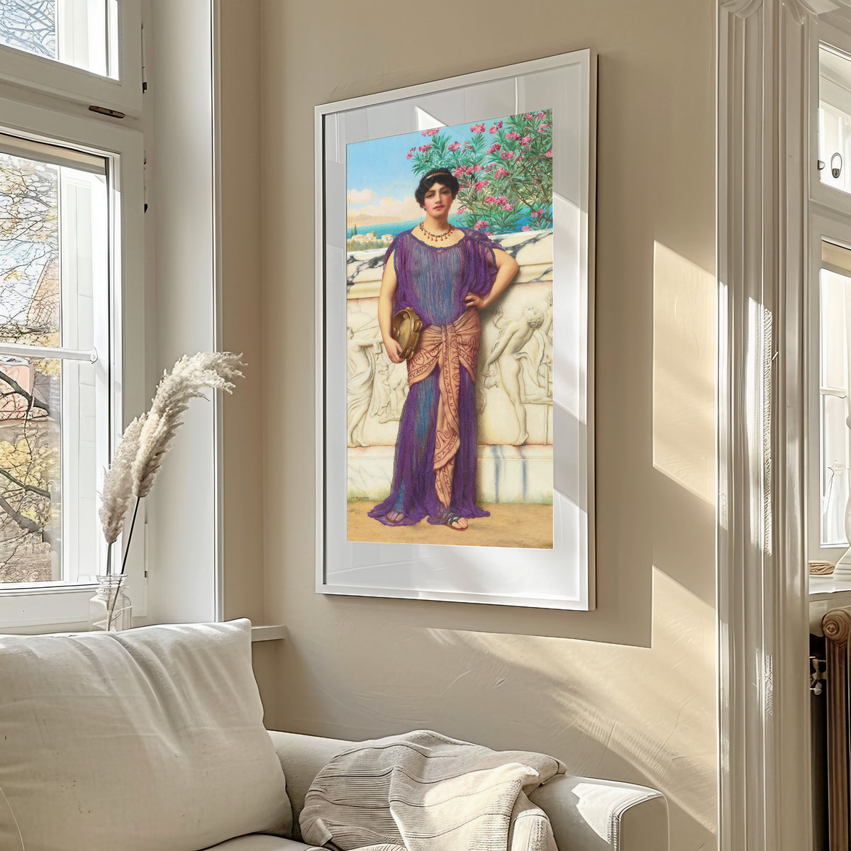 Framed art print of The Tambourine Girl by John William Godward, in a sunlit living room above a sofa