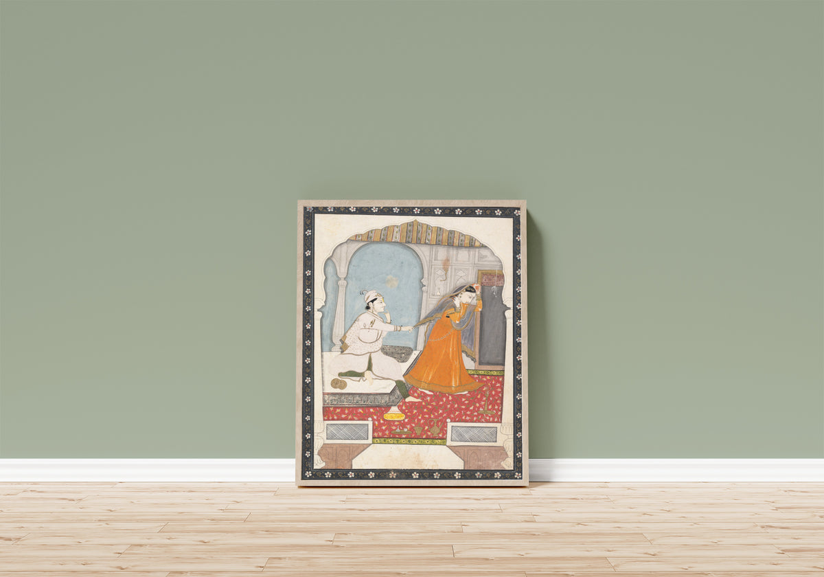 Framed art print of The Timid Bride by Kangra school, in a light wood frame leaning on a sage green wall above a wooden floor