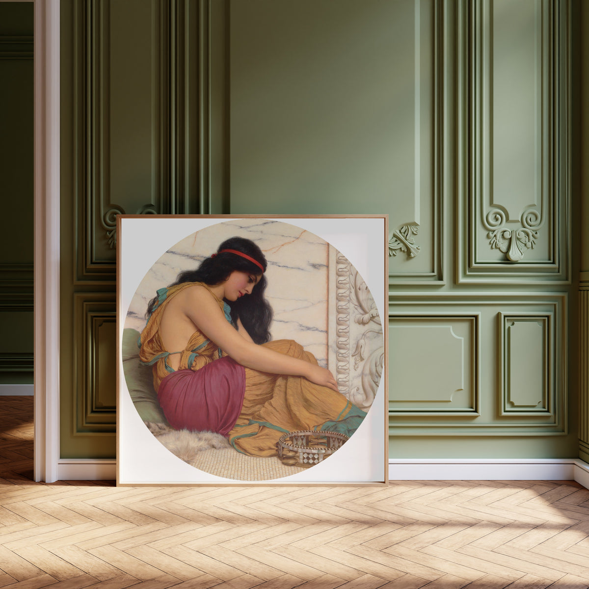 Framed art print of The Tired Danseuse by John William Godward, leaning against olive-green panelling on a herringbone floor