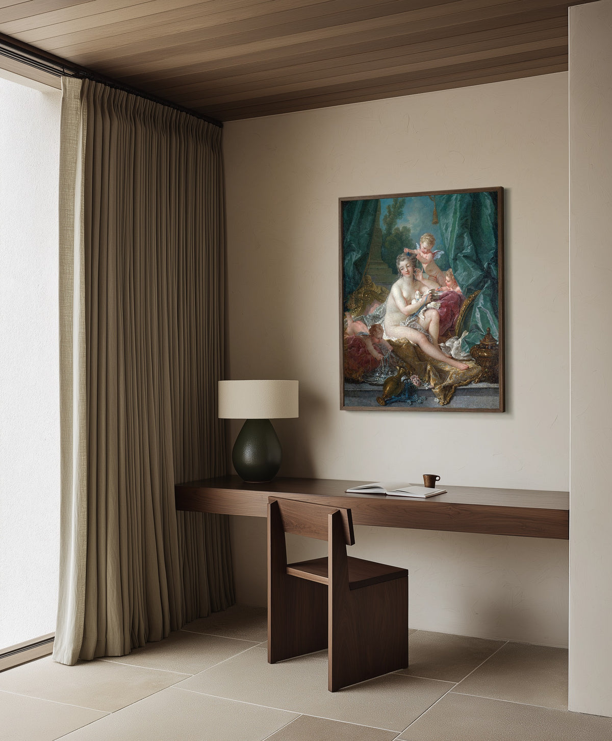 Framed art print of The Toilette of Venus by François Boucher, in a dark wood frame on a plaster wall above a walnut desk