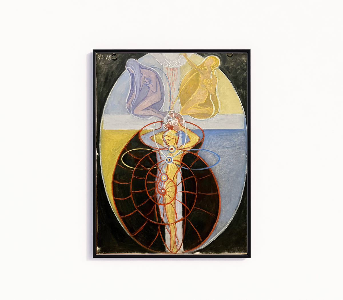 Framed art print of The US Series, Group VIII, No. 1 by Hilma af Klint, in a slim black frame on a plain white wall