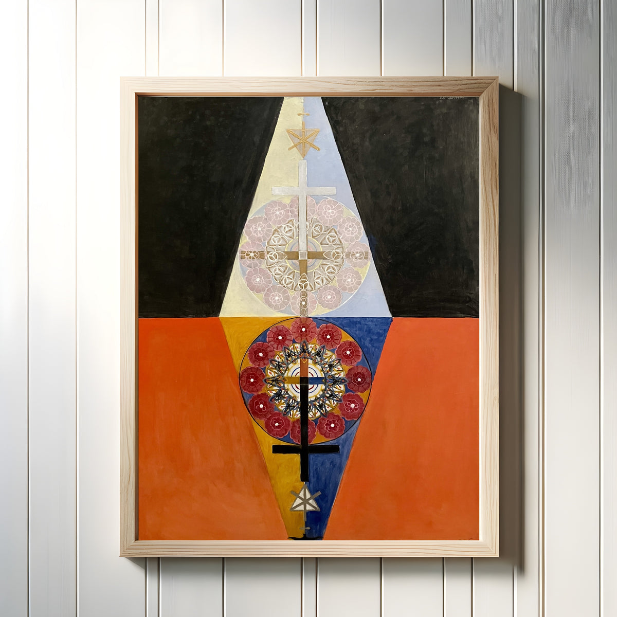Framed art print of The US Series, Group VIII, No. 6 by Hilma af Klint, in a light wood frame on a white panelled wall