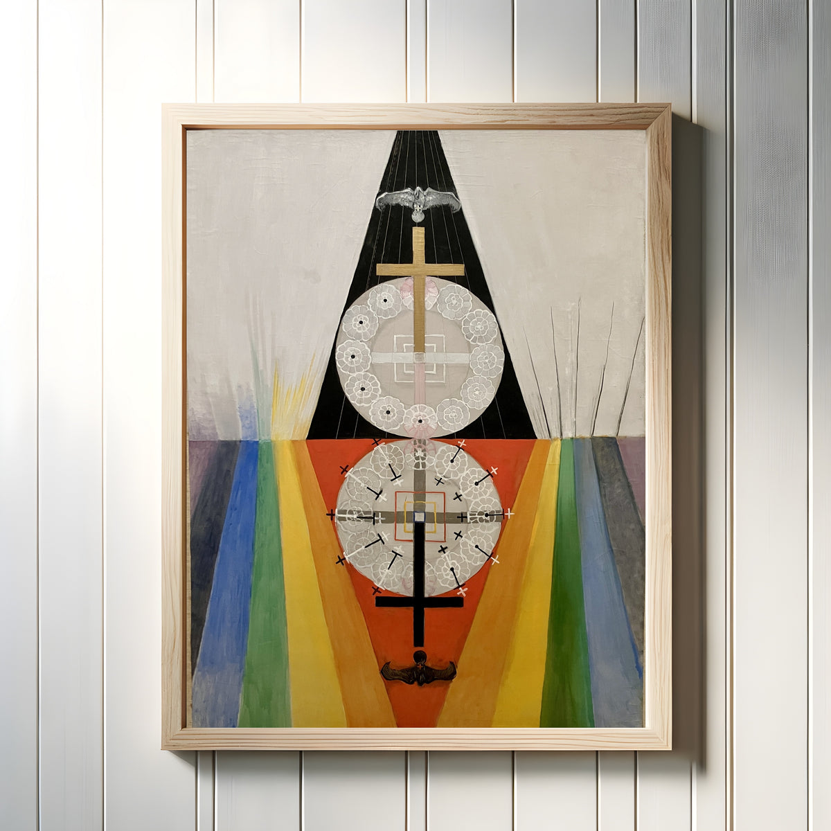 Framed art print of The US Series, Group VIII, No. 7 by Hilma af Klint, in a light wood frame on a white panelled wall