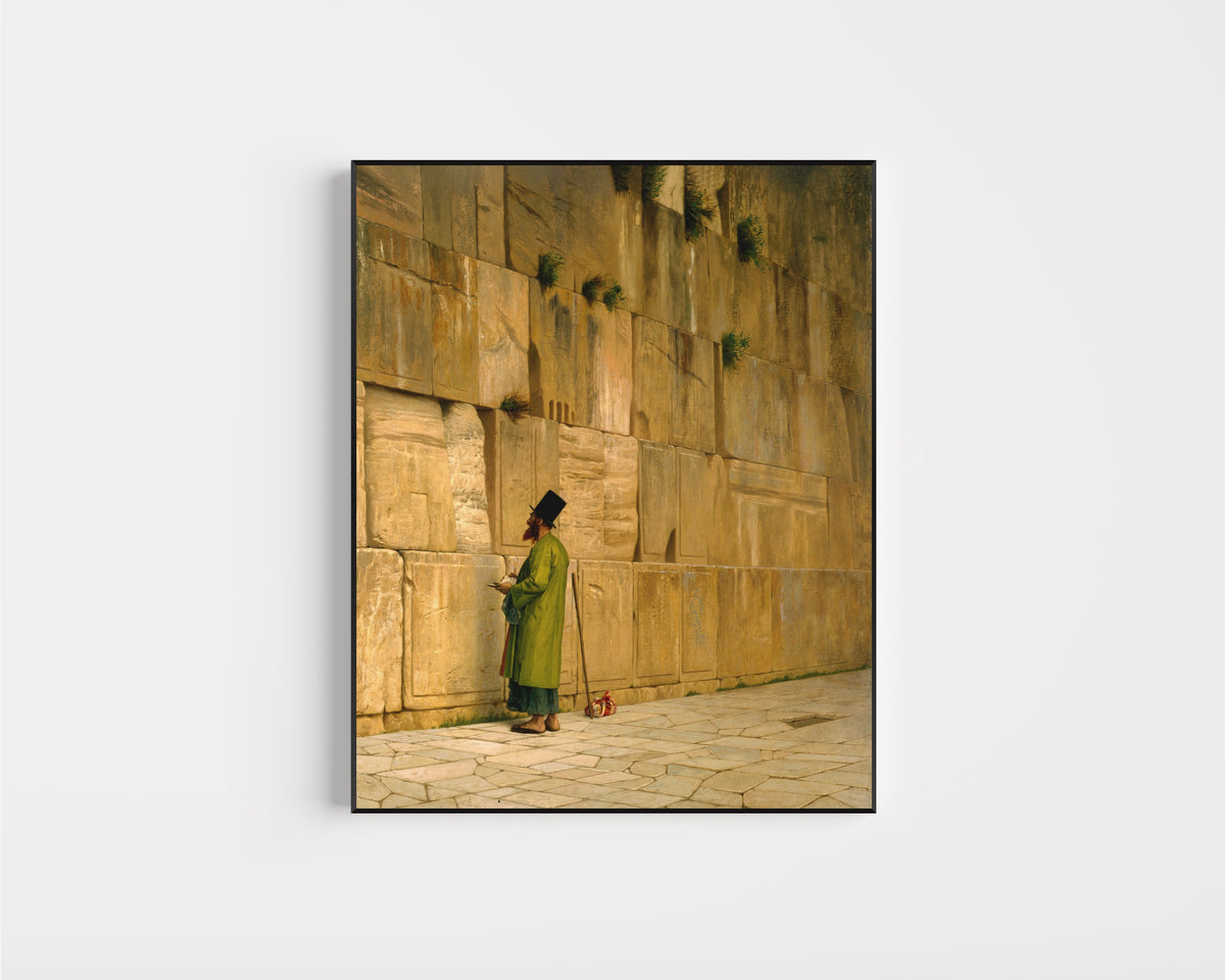 Framed art print of The Wailing Wall by Jean-Léon Gérôme, in a slim black frame on a plain white wall