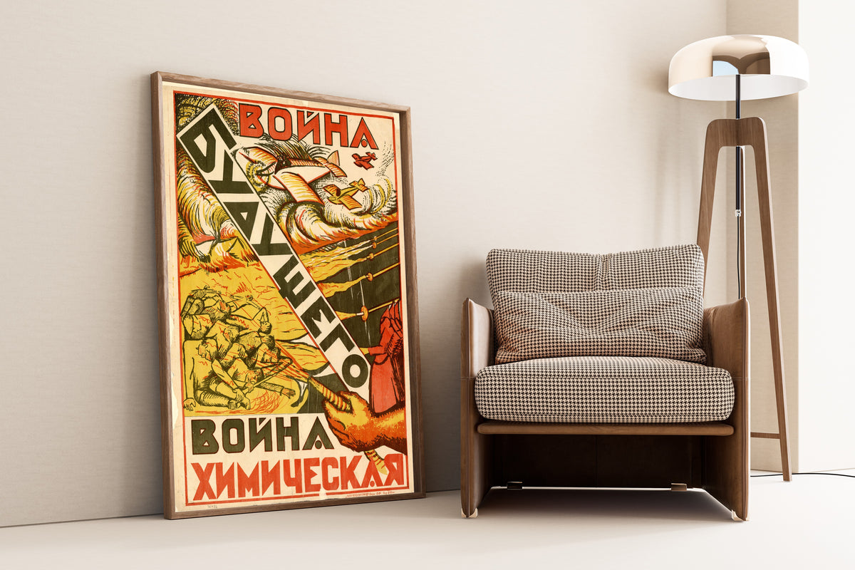 Framed art print of The War of the Future Is a Chemical War, leaning against a wall beside an armchair and a floor lamp