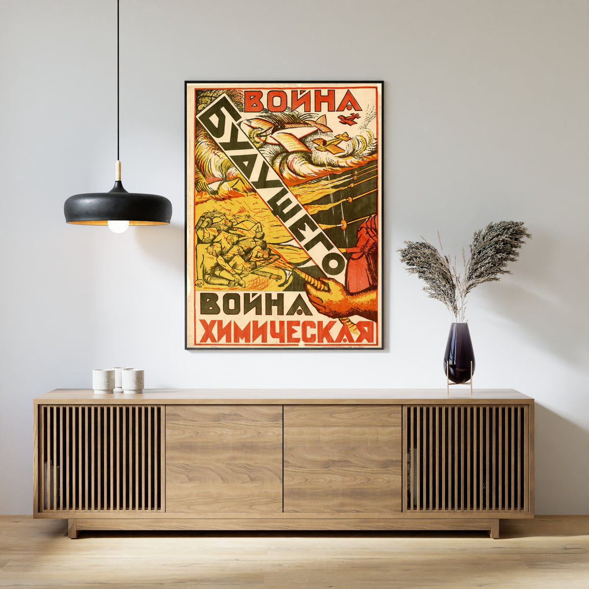 Framed art print of The War of the Future Is a Chemical War, above a slatted wood sideboard