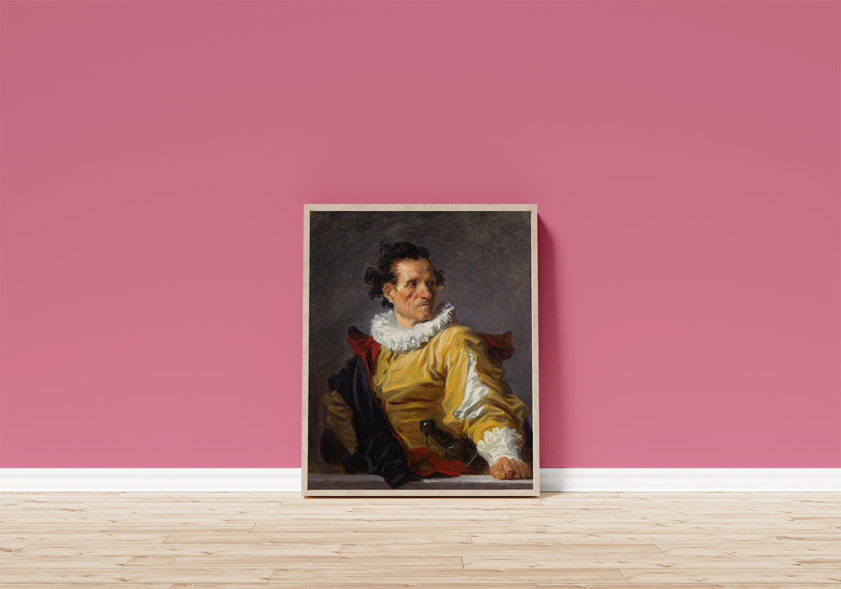 Framed art print of The Warrior by Jean-Honoré Fragonard, in a light wood frame leaning on a pink wall above a wooden floor