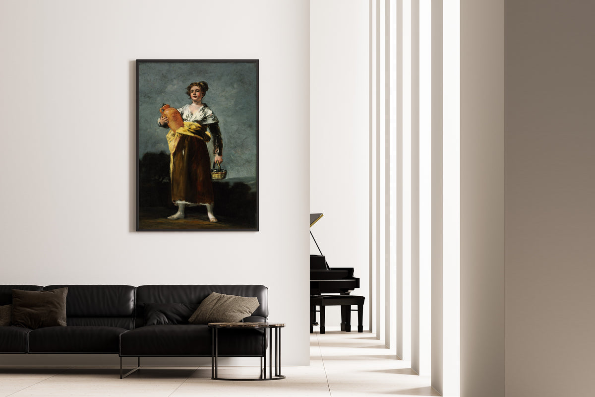 Framed art print of The Water Carrier (La Aguadora) by Francisco de Goya, on the wall of a minimal living room