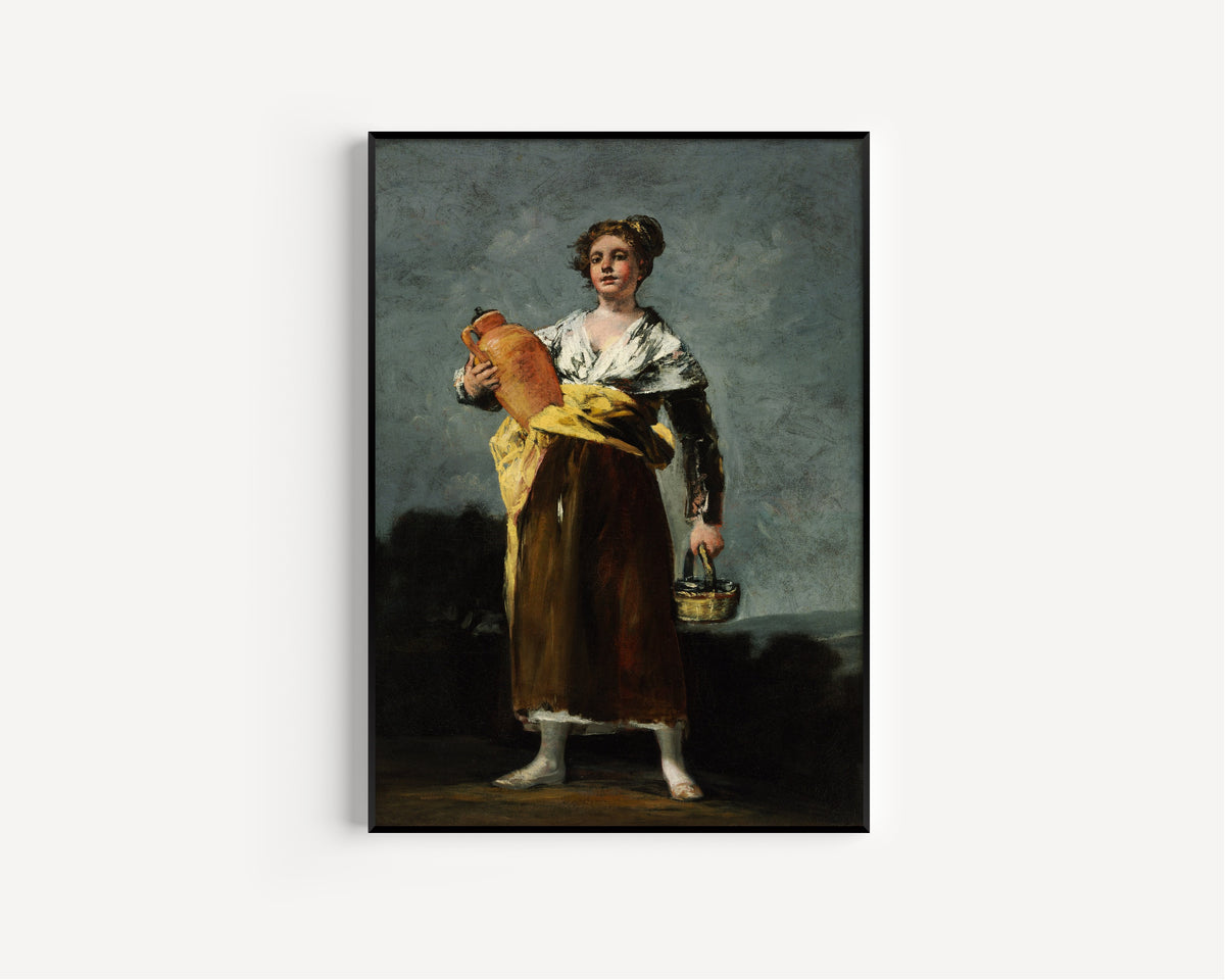 Framed art print of The Water Carrier (La Aguadora) by Francisco de Goya, in a slim black frame on a plain white wall