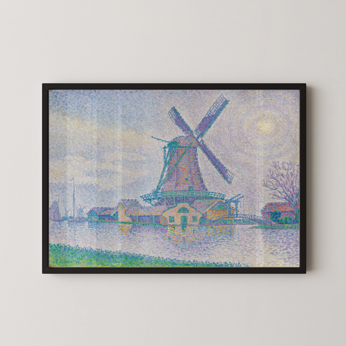 Framed art print of The Windmill at Edam by Paul Signac, in a black frame on a pale wall