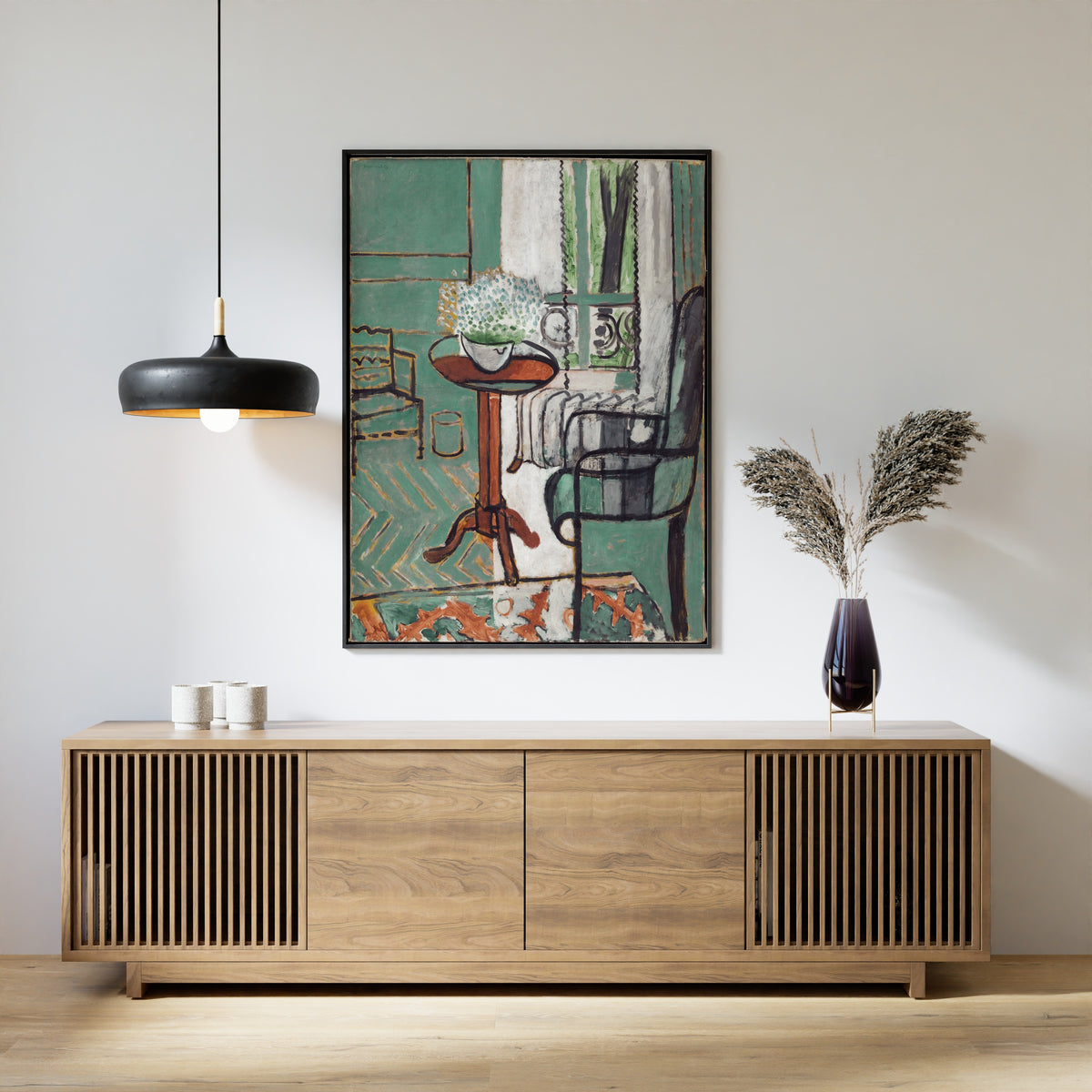 Framed art print of The Window by Henri Matisse, above a slatted wood sideboard