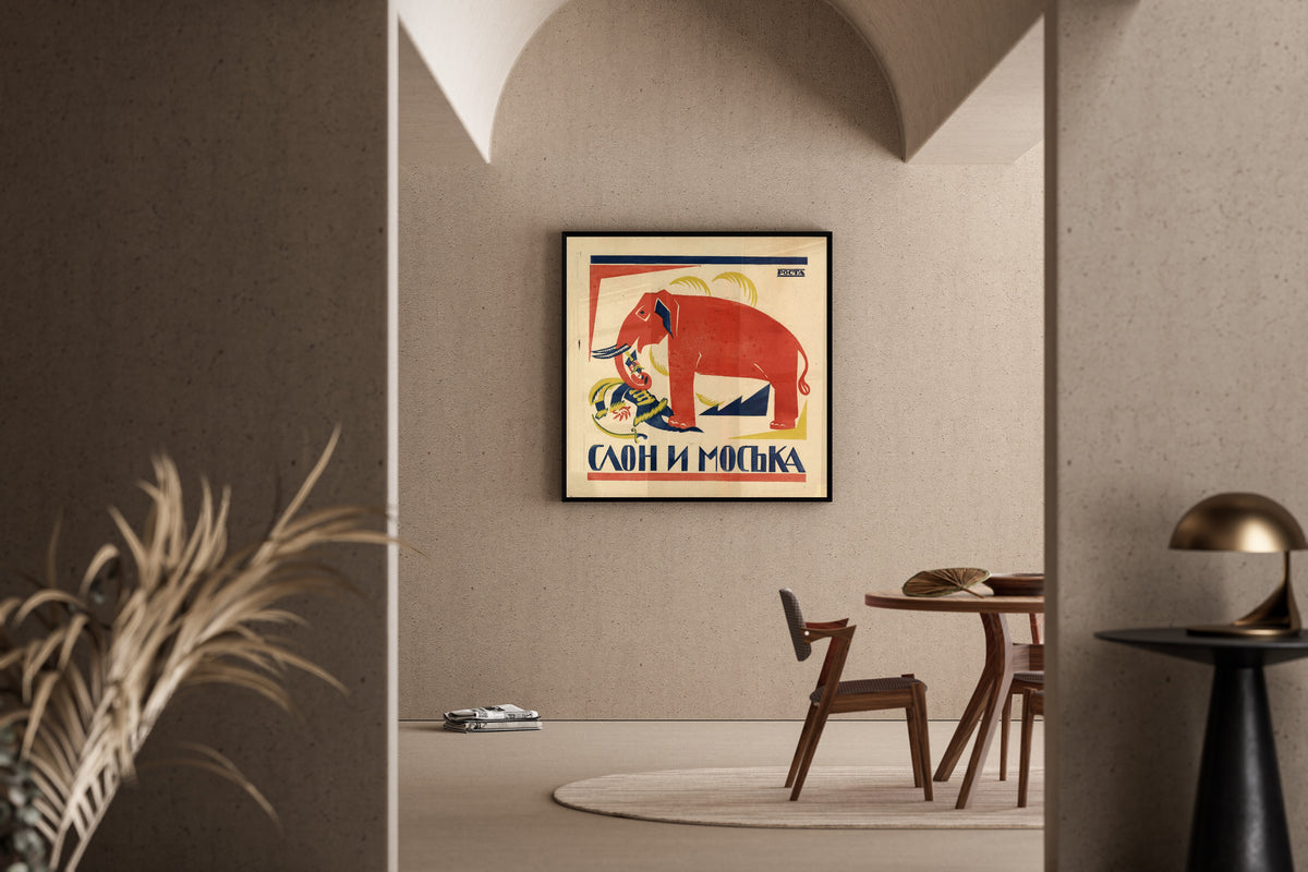 Framed art print of The elephant and the pug by Vladimir Mayakovsky, in a sunlit dining corner