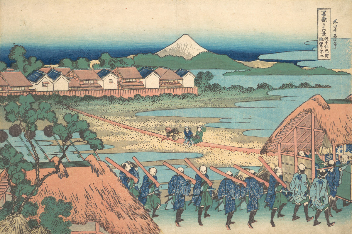 Thirty-six Views of Mount Fuji: Fuji Seen in the Distance from Senju Pleasure Quarter by Katsushika Hokusai — Men shoulder red timbers past thatched roofs