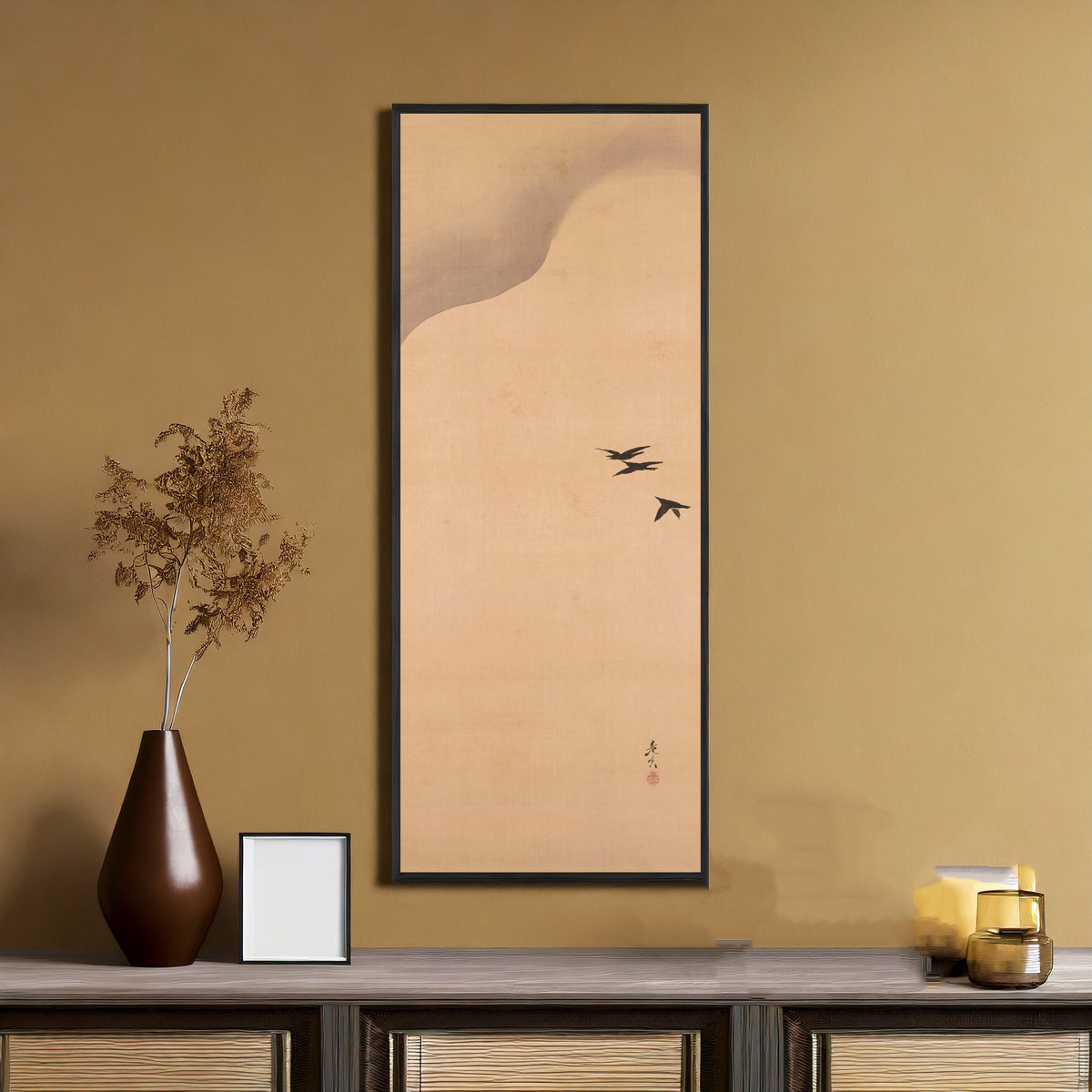 Noh Play Hachinoki, three of three by Shibata Zeshin — framed on an ochre wall above a console table