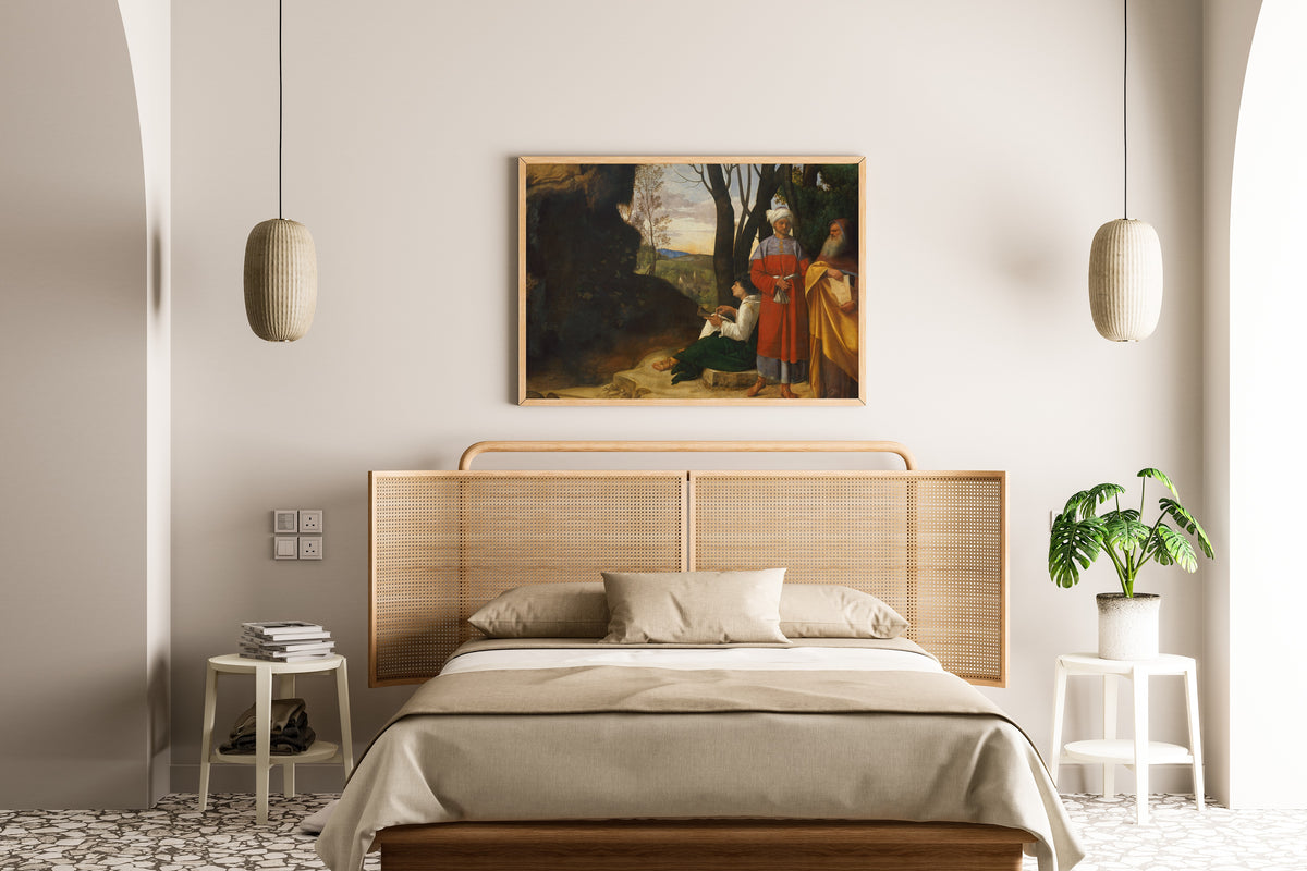 Framed art print of Three Philosophers by Giorgione, above a cane-headboard bed