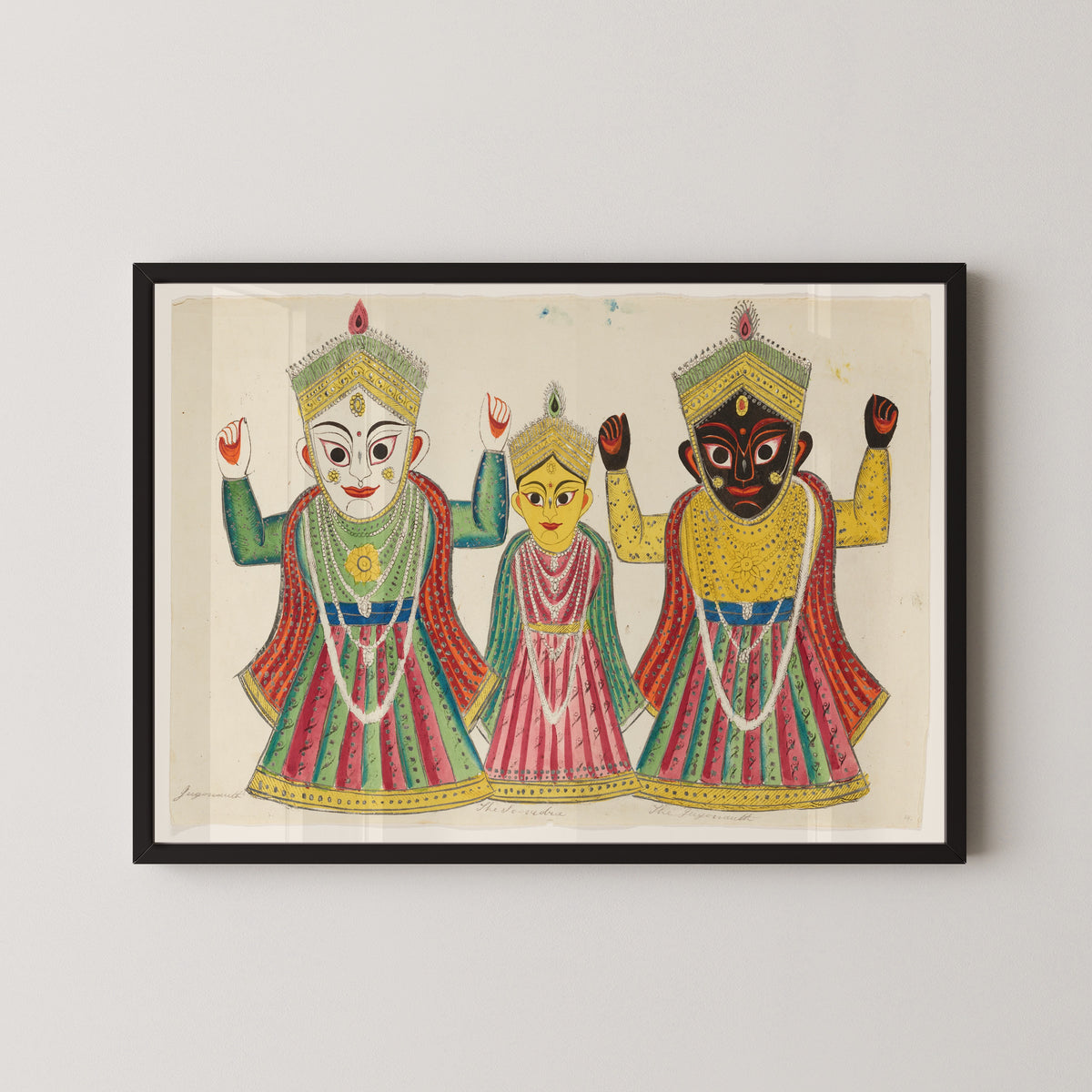 Framed art print of Three Temple Banners by Kalighat painter, in a black frame on a pale wall