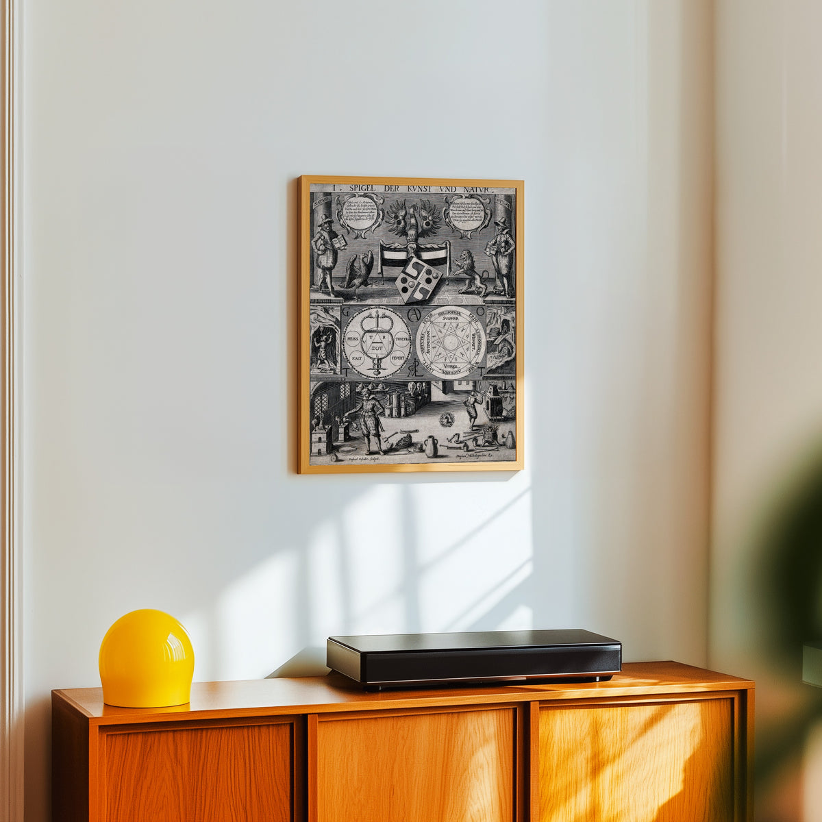 Framed art print of Three-Tiered Symbolic Diagram of the Art of… by Stephan Michelspacher, in a light wood frame on a white wall above an orange sideboard