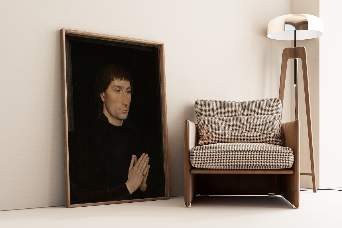 Framed art print of Tommaso di Folco Portinari by Hans Memling, leaning against a wall beside an armchair and a floor lamp
