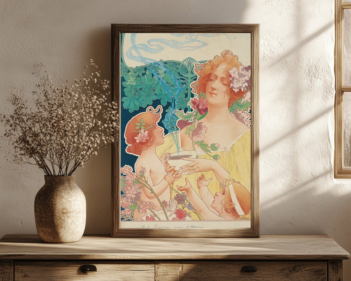 Framed art print of Tropon Chocolat-Cacao (before letters) by Henri Privat-Livemont, in a dark wood frame leaning on a rustic console beside dried flowers