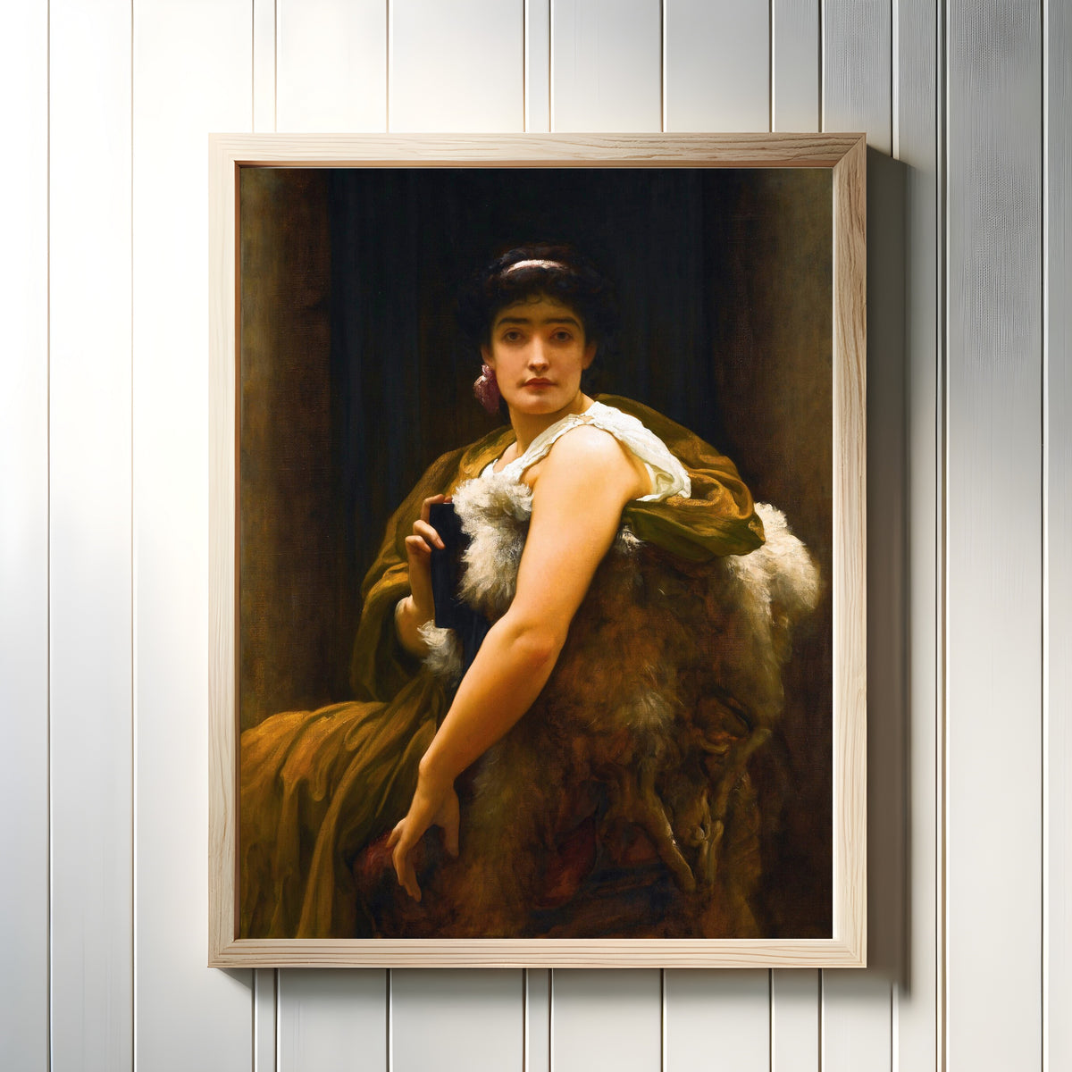Framed art print of 'Twixt Hope and Fear by Frederic Leighton, in a light wood frame on a white panelled wall