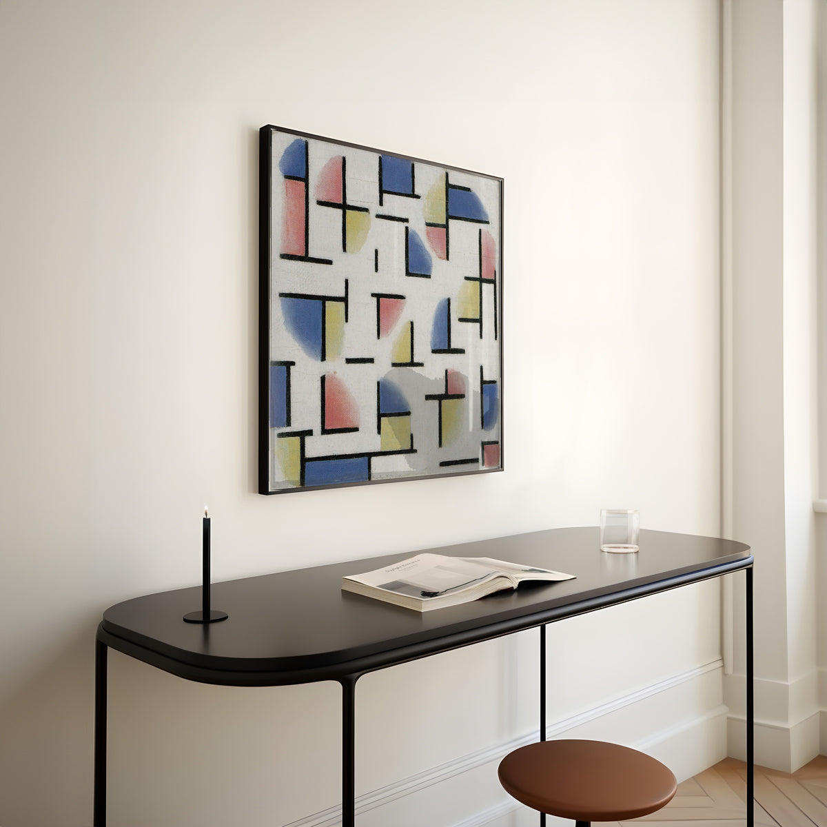 Framed art print of Variation on Composition XIII by Theo van Doesburg, above a slim black console table