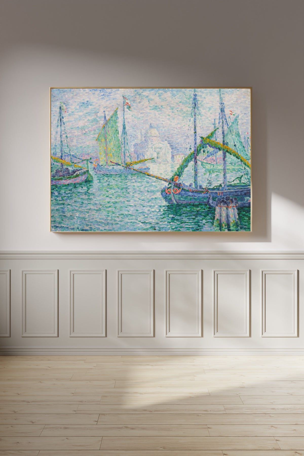 Framed art print of Venice, Il Redentore by Paul Signac, on a panelled wall in afternoon light