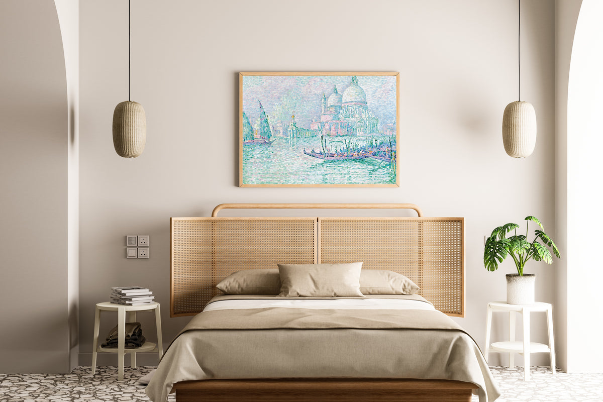 Framed art print of Venice, La Salute, Green by Paul Signac, above a cane-headboard bed