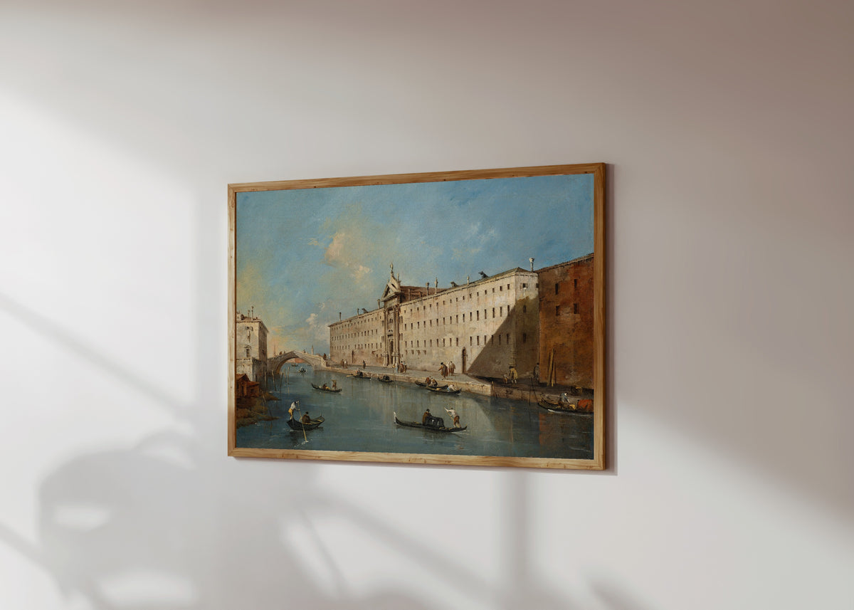 Framed art print of Venice, the Rio dei Mendicanti Looking North… by Francesco Guardi, in a light wood frame on a sunlit white wall, seen at a slight angle