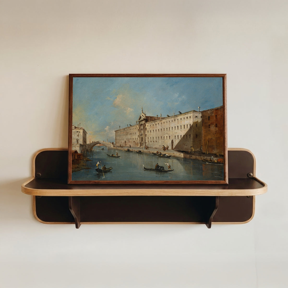 Framed art print of Venice, the Rio dei Mendicanti Looking North with the Church of San… by Francesco Guardi, in a dark wood frame resting on a wall shelf