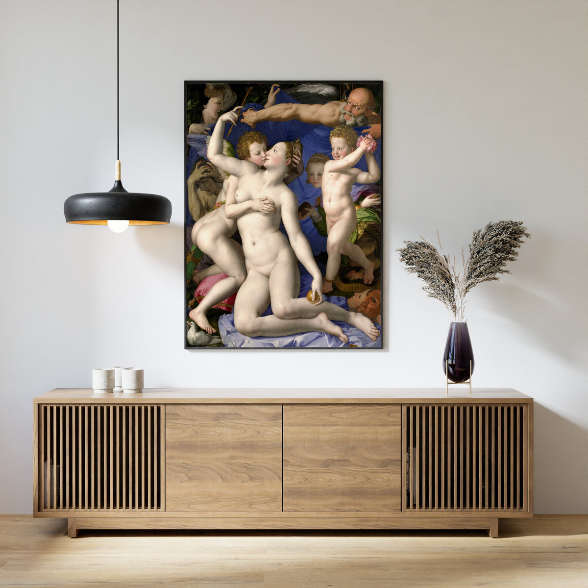 Framed art print of Venus, Cupid, Folly and Time by Bronzino, above a slatted wood sideboard