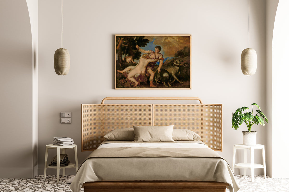 Framed art print of Venus and Adonis by Titian, above a cane-headboard bed